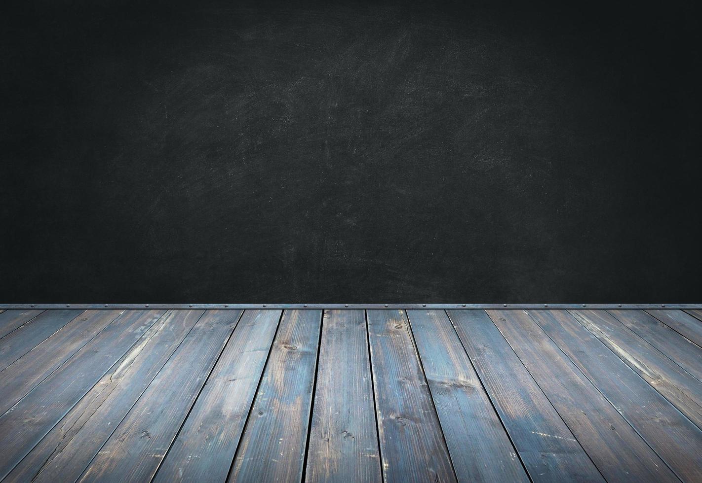 Wood table with blackboard background photo