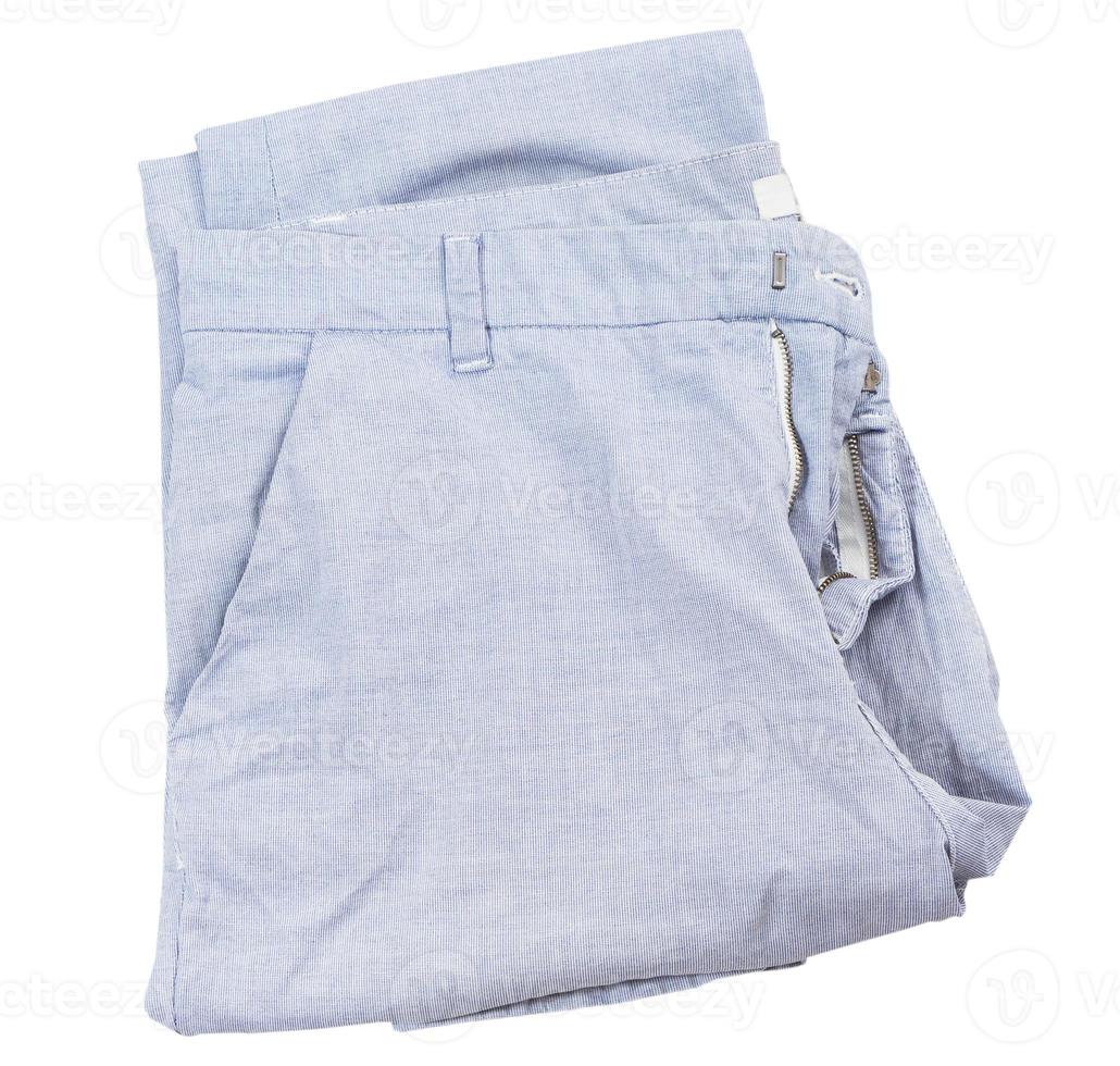 Ligt blue pants isolated on white background, folded pants top view, fashion cloth element flatlay photo