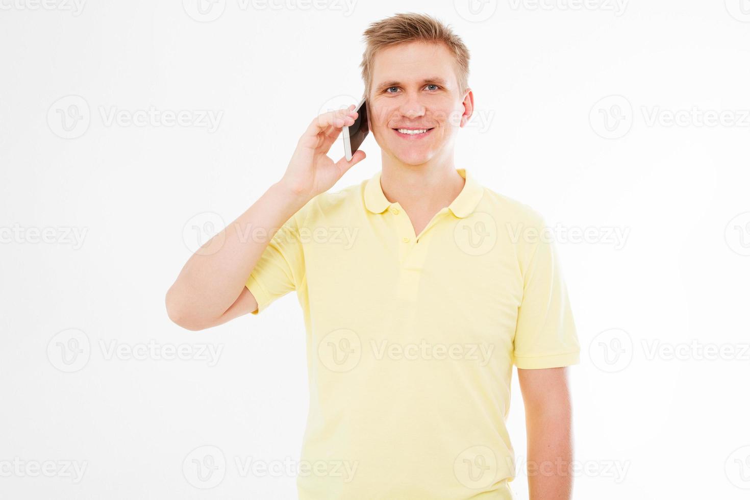 happy man in t-shirt talking on his mobile phone isolated on white photo
