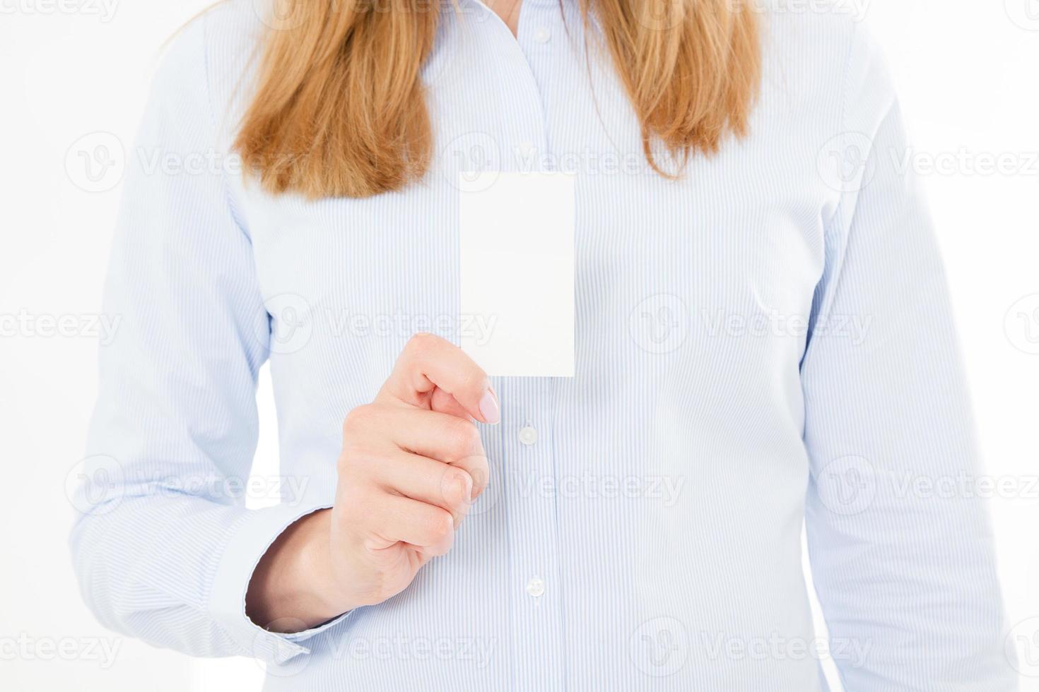 woman holding a blank business card isolated on white background. Copy space photo