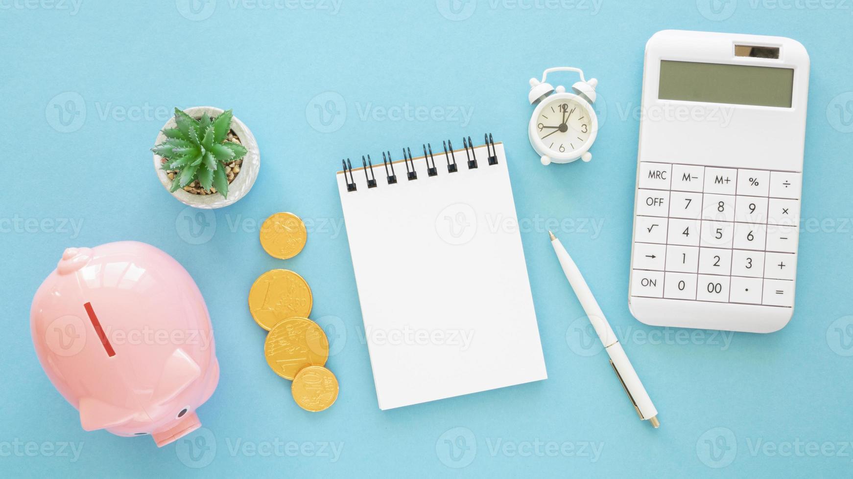 flat lay finance elements assortment with empty notepad photo