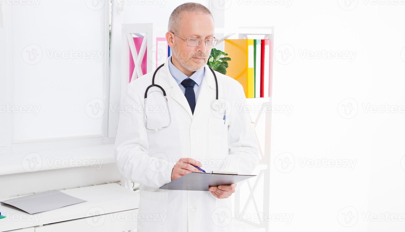 portrait of male doctor posing photo