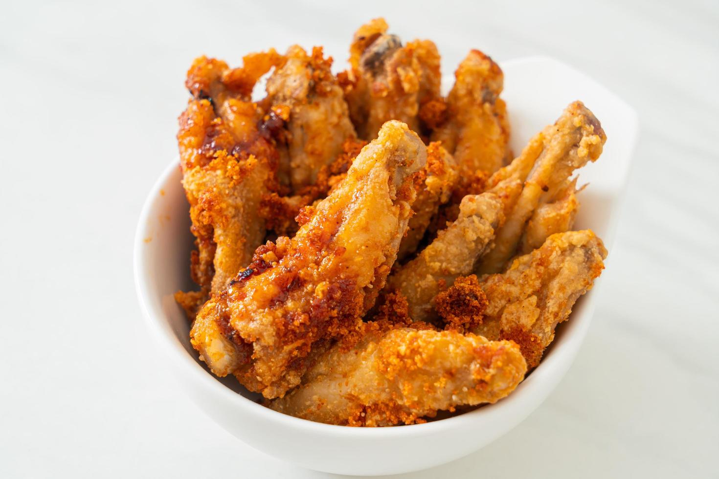 fried barbecue chicken wings in bowl photo