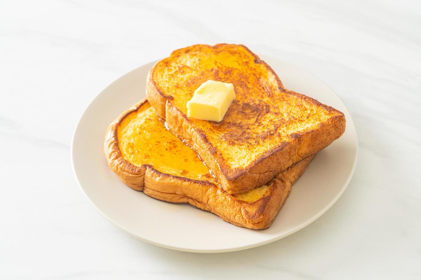 French toasted with butter and honey photo