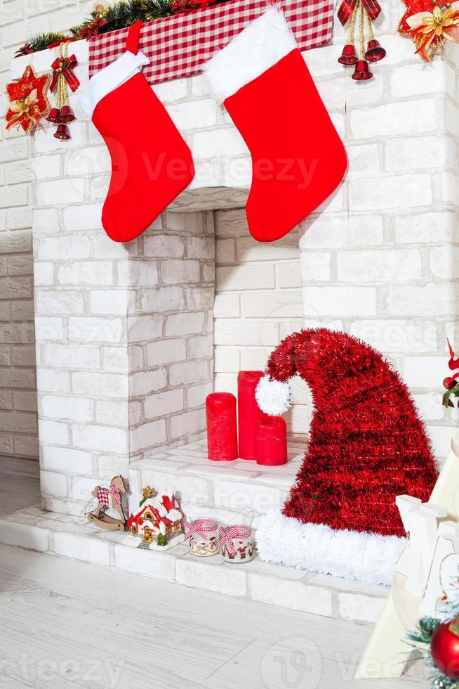 Decorative fireplace decorated with garlands and New Year's decor photo