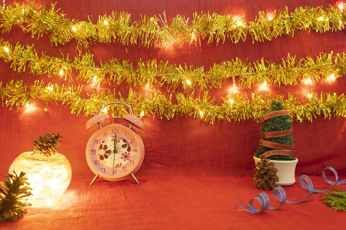 Minimalist concept idea displaying products. christmas and new year background.red, lights, pine flower photo