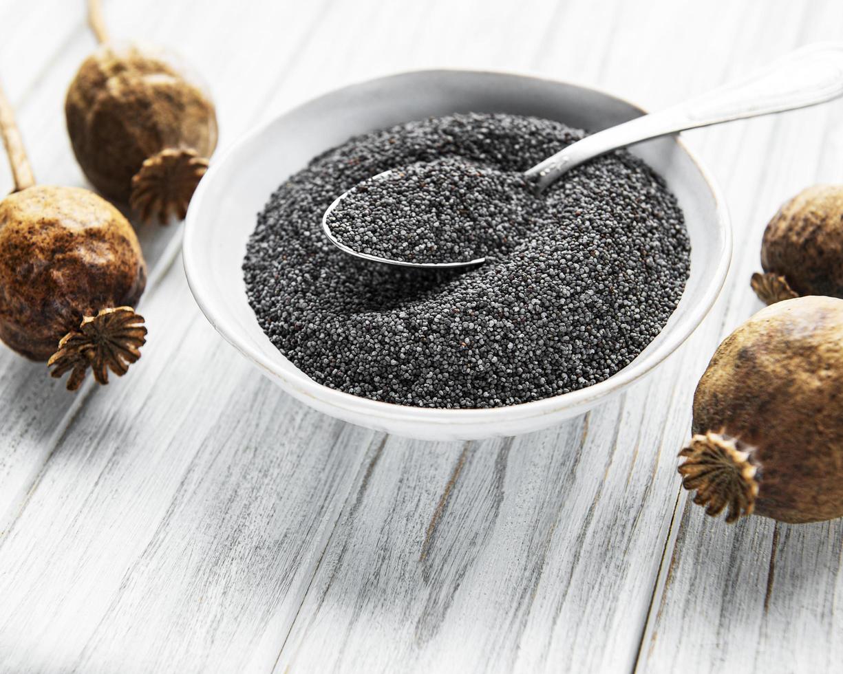 Poppy seeds in small  bowl photo