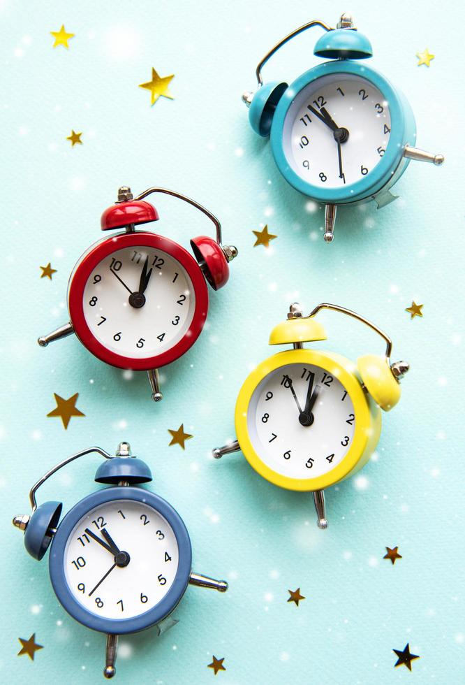 Flat lay Christmas composition with color clocks photo
