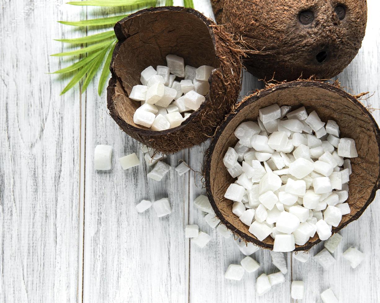 Dried sweet coconut cubes  in bowl photo