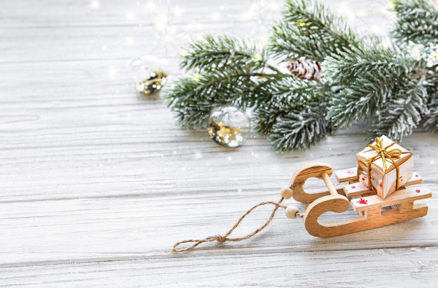 Christmas toys sled with gift box photo