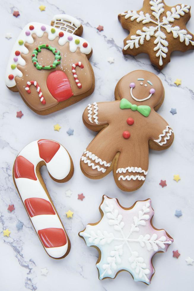 Christmas gingerbread cookies on white marble background photo