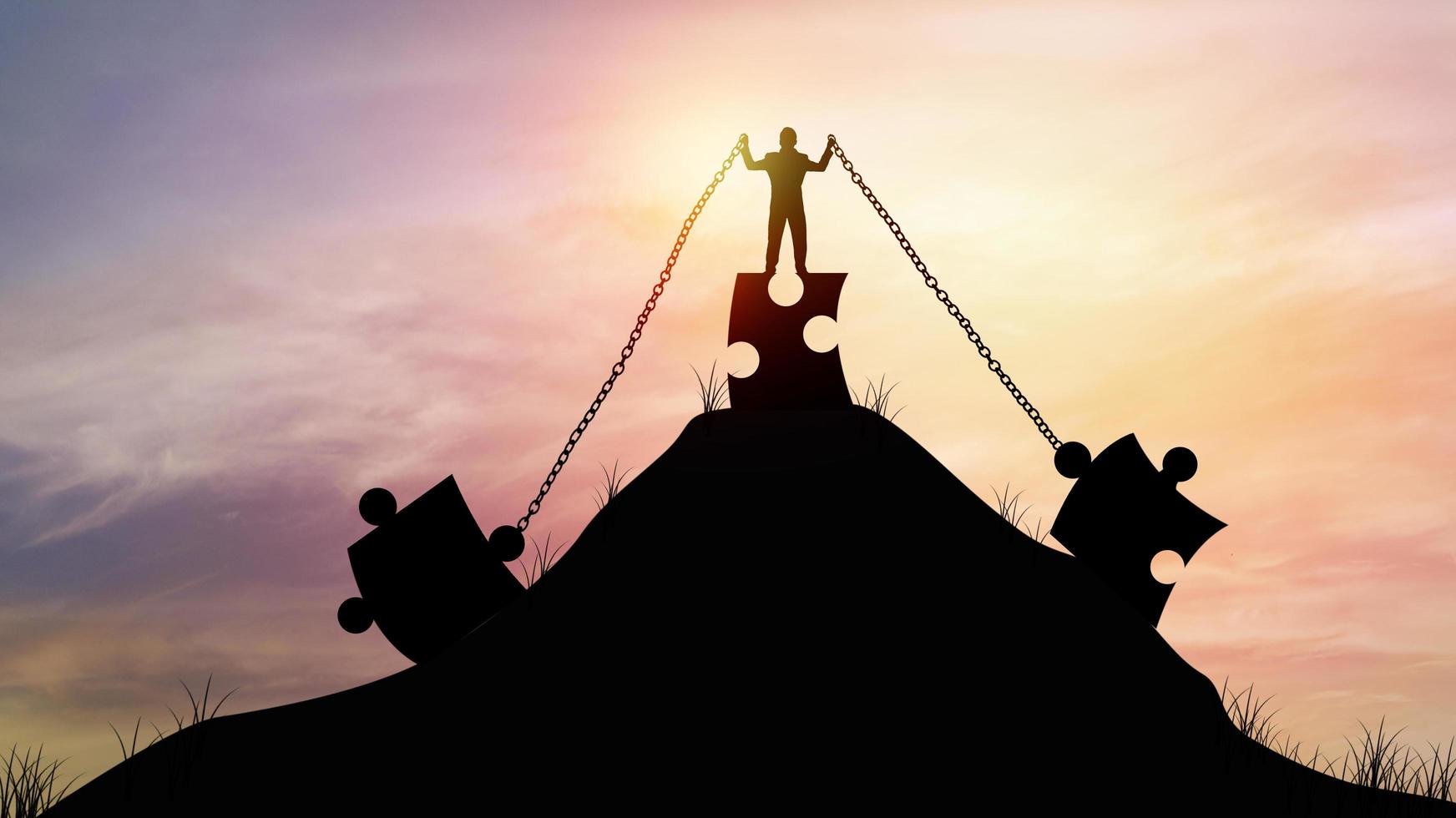 silhouette  people pull jigsaw with chain on top of mountain, concept as strength, effort and intent to build and improve to success in business photo