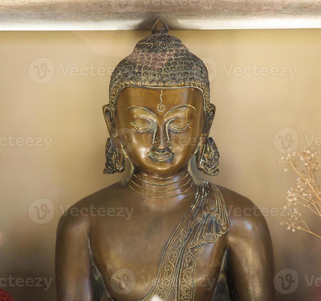 Bronze statue of seated Buddha photo