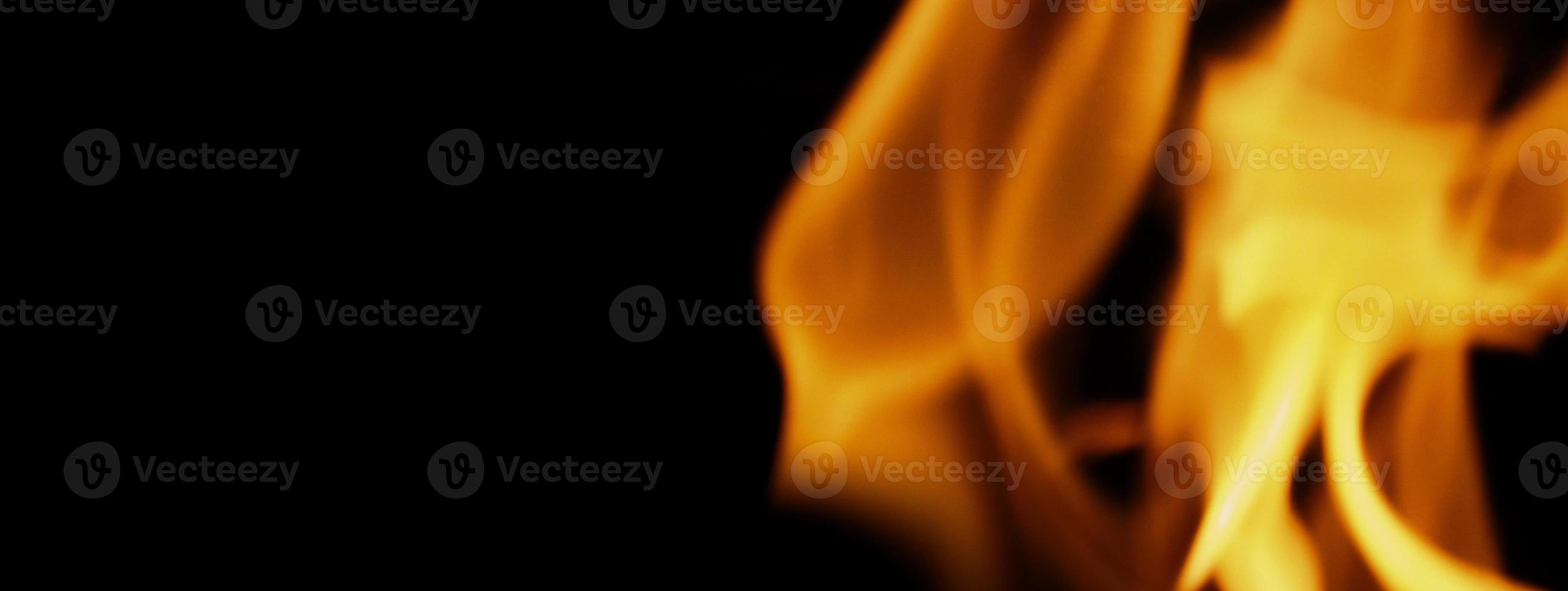 Fire background. Abstract burning flame and black background. photo