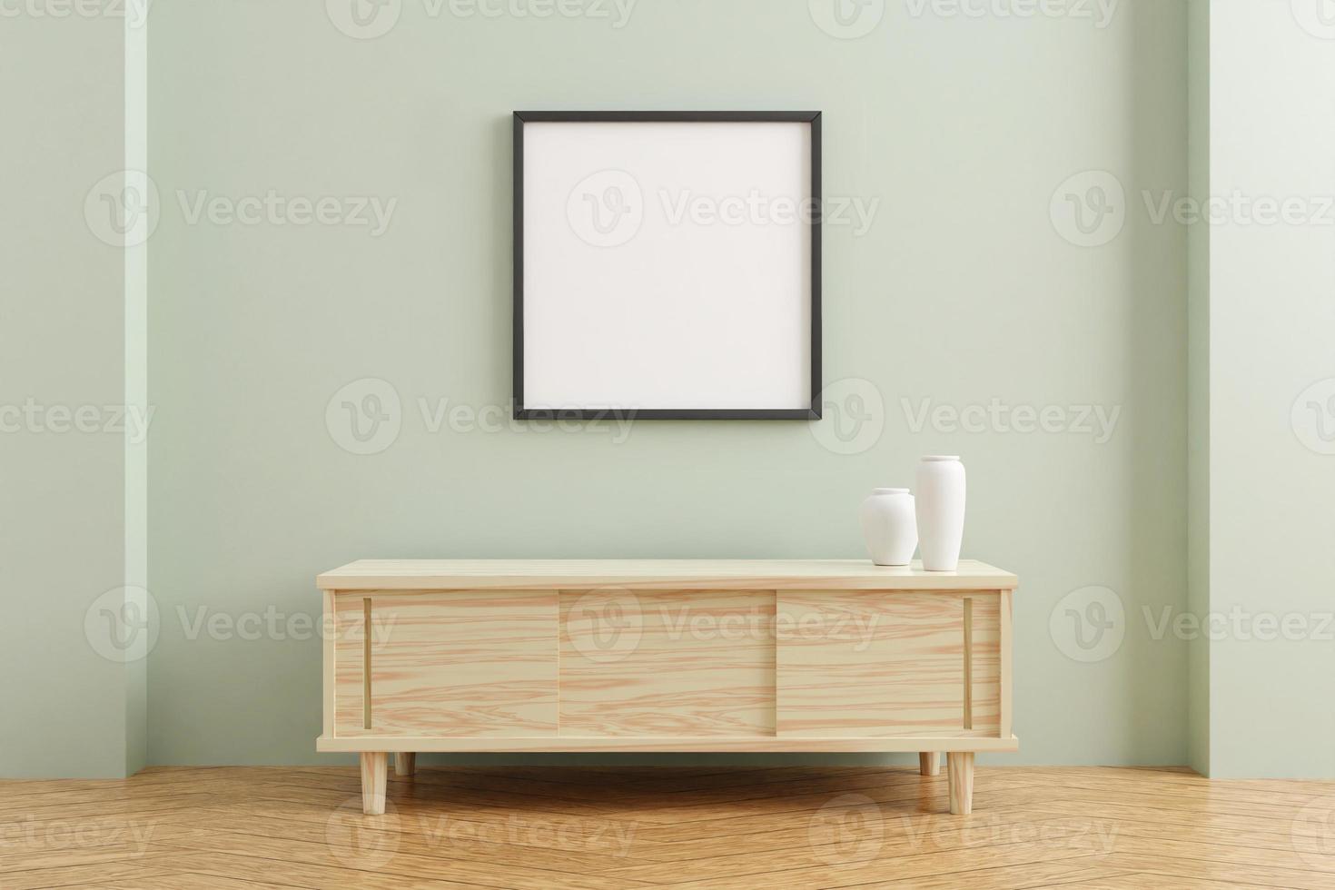 Black square poster frame mockup on wooden table in living room interior on empty pastel color wall background. 3D rendering. photo