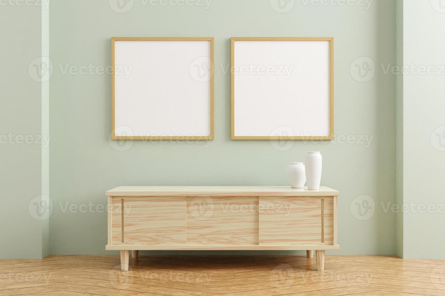 Dos maquetas de marco de cartel de madera cuadrado sobre mesa de madera en el interior de la sala de estar sobre fondo de pared de color pastel vacío. Representación 3D. foto