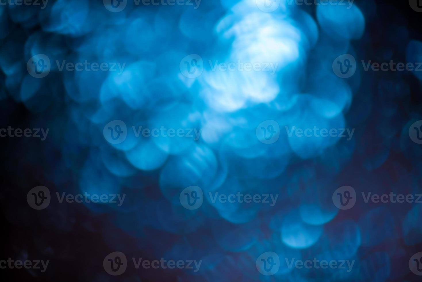 Round shape defocus lights are blue. Material for the designer. Blurred bokeh. photo