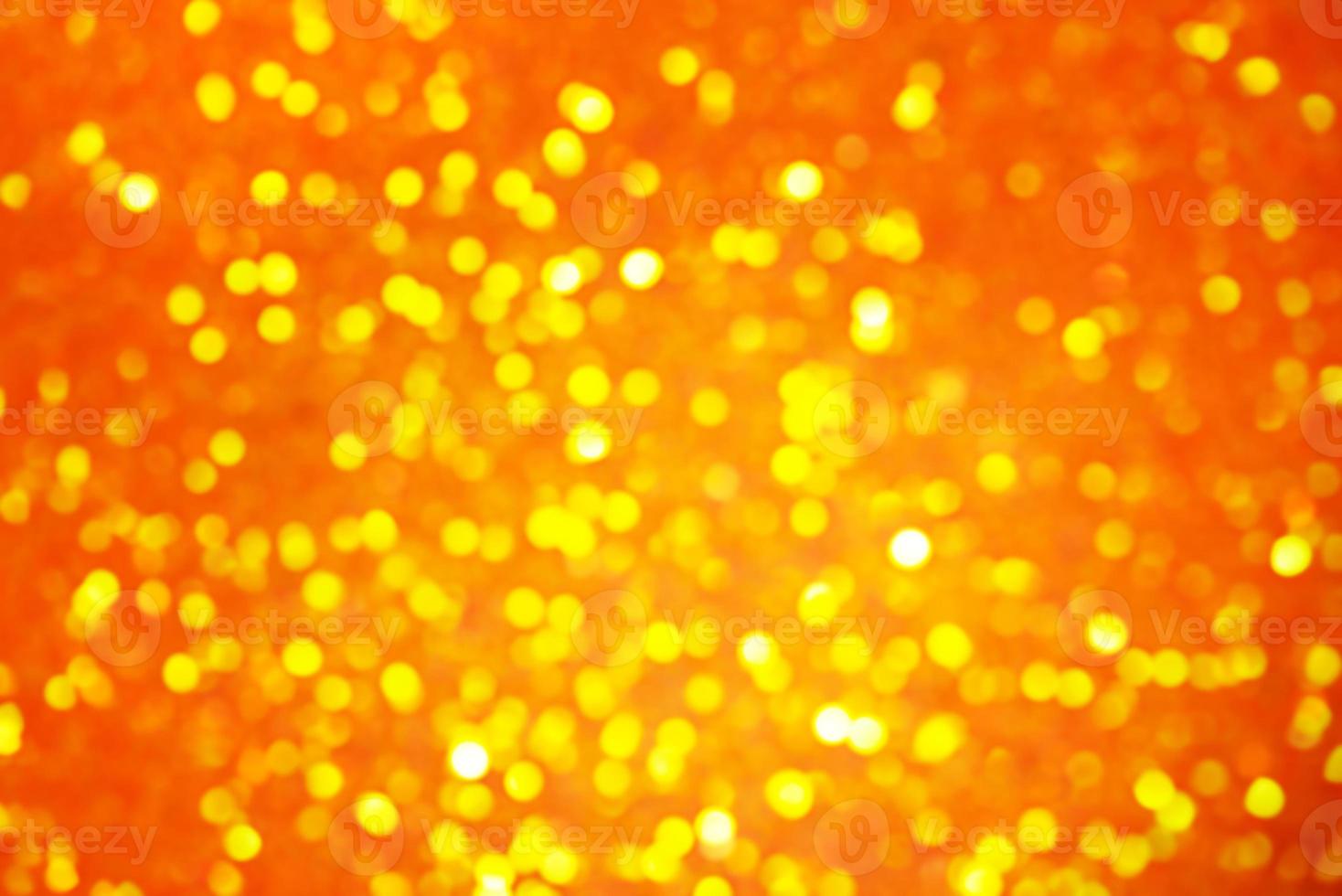 Defocus light orange and yellow glitter. Abstract bokeh light background. photo