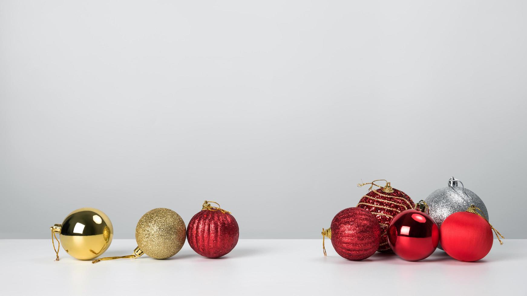 Christmas composition. Christmas balls with red on white background. photo