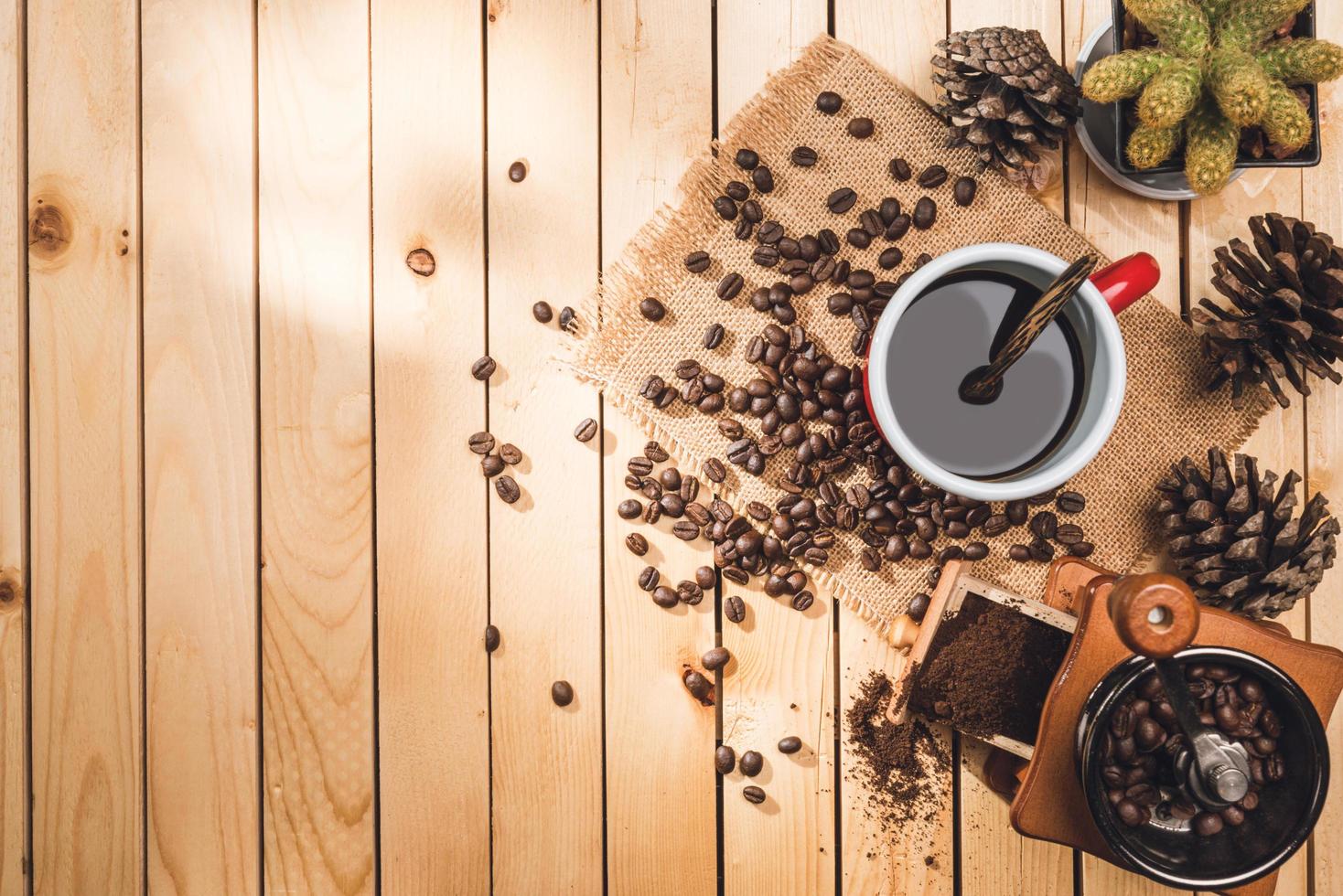 black coffee and coffee beans on the table wooden background and accessories Ingredients for making coffee photo