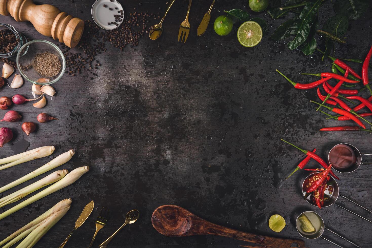 Spices for use as cooking ingredients on a wooden background with Fresh vegetables. Healthy food herbs. Organic vegetables on the table. Raw materials of cooking preparation Tom Yum. photo