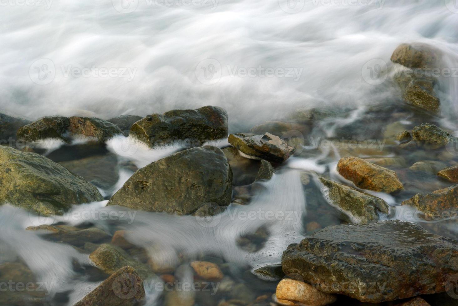 Turbulence sea water and rock at Coastline photo