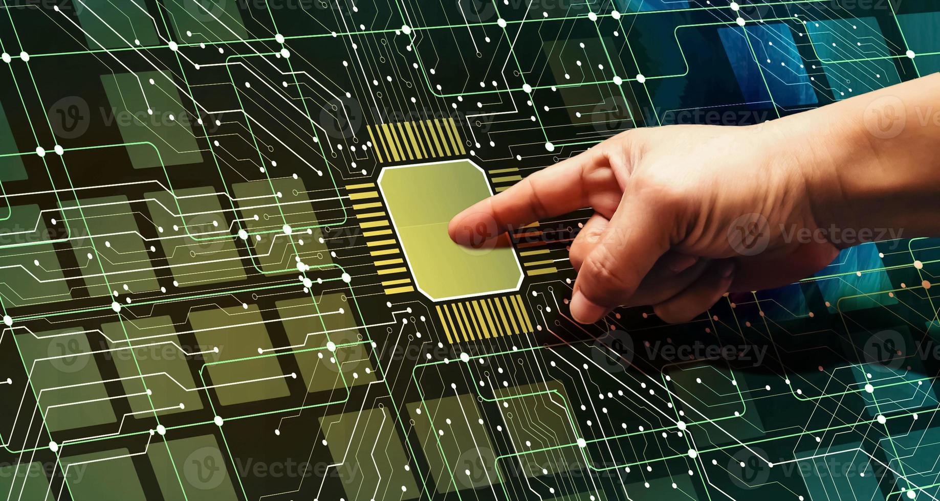 Right hand pointing at a computer chip. Electrical diagram. Integrated circuit. photo