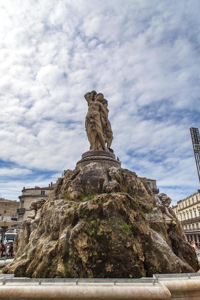 MONTPELLIER, FRANCE, JULY 13, 2015 - The three graces fountain at Place de la Comedie. Fountain Three Graces, built by sculptor Etienne d'Antoine in 1790. photo