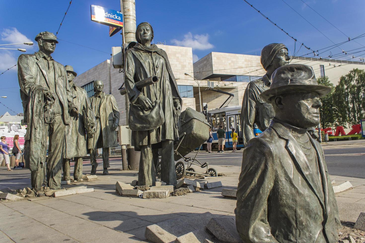 WROCLAW, POLAND, JUNE 11, 2018 - The Anonymous Pedestrians sculptures from Wroclaw, Poland. These 14 figures were made by Polish artist Jerry Kalina in 2005. photo