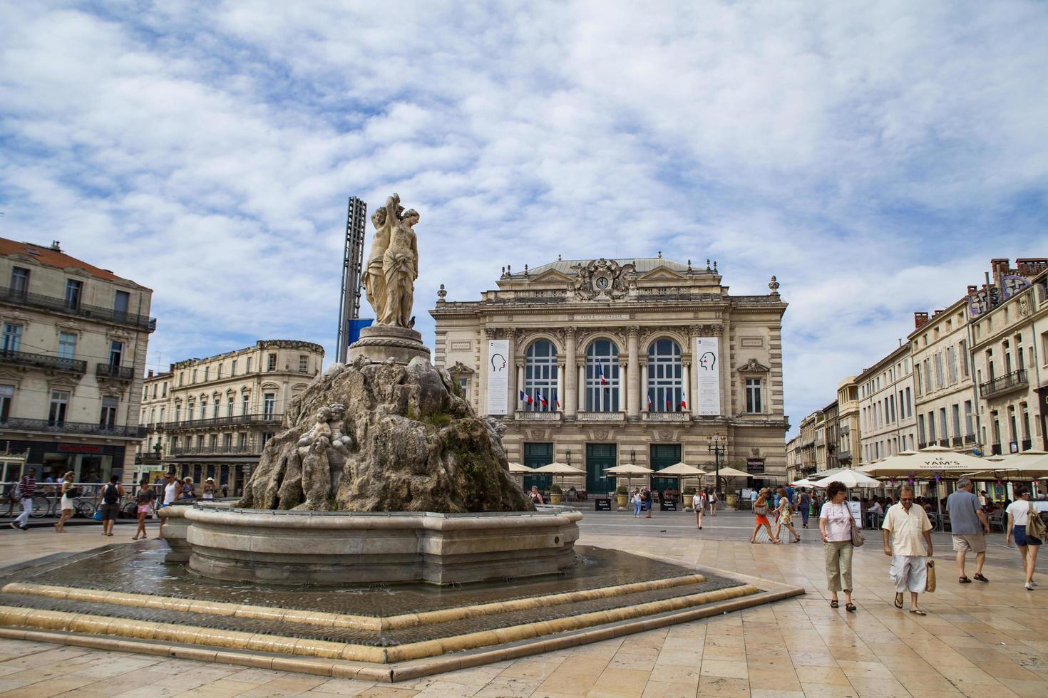 MONTPELLIER, FRANCE, JULY 13, 2015 - The three graces fountain at Place de la Comedie. Fountain Three Graces, built by sculptor Etienne d'Antoine in 1790. photo