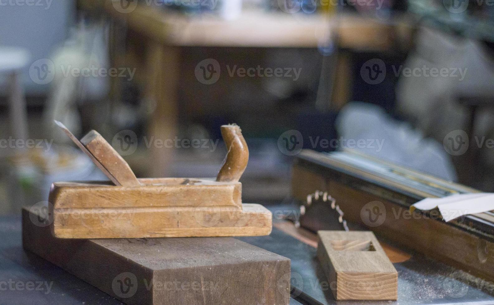 Antique plane on the background of the carpentry workshop photo