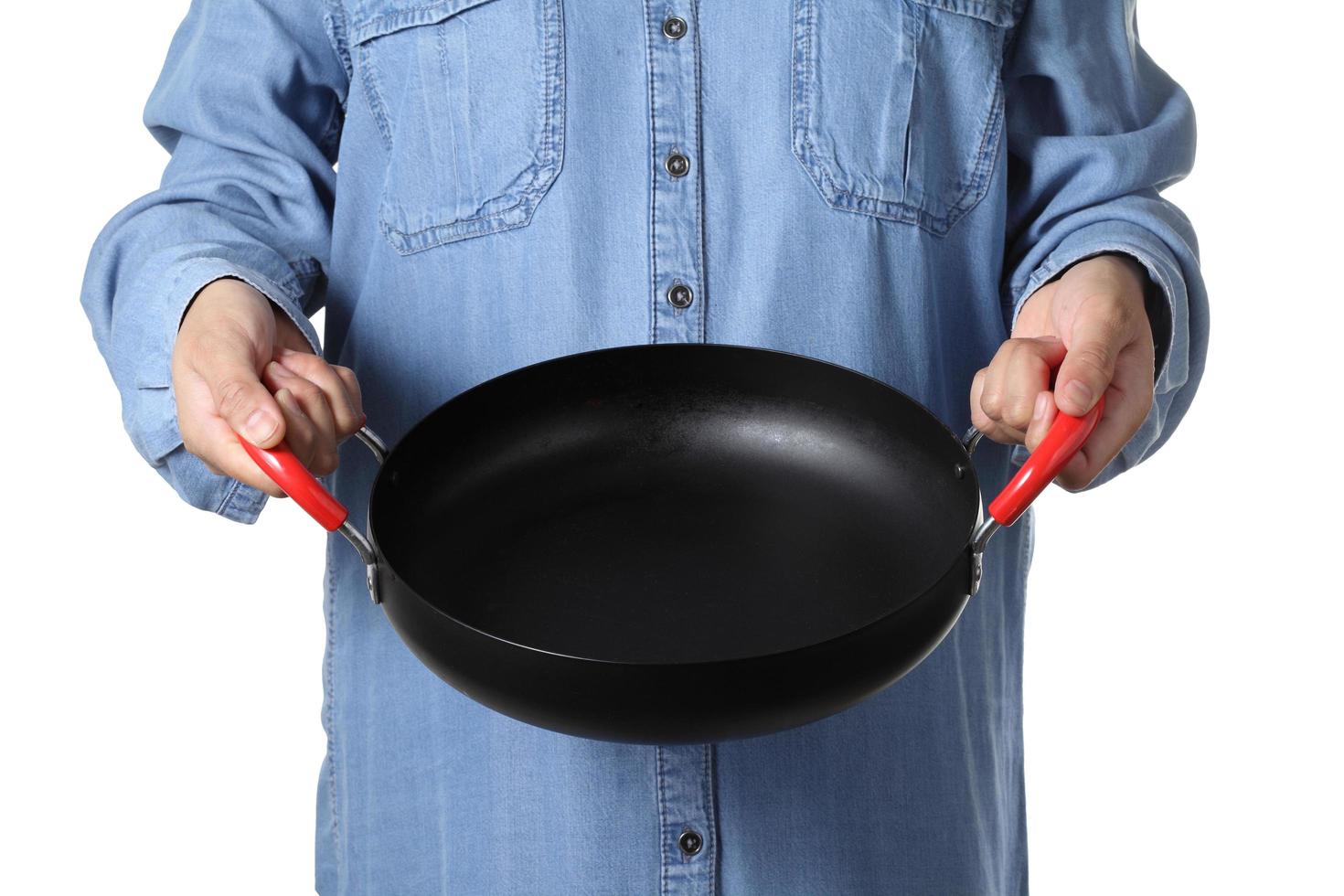Young woman girl holding Chinese iron pan on white background photo