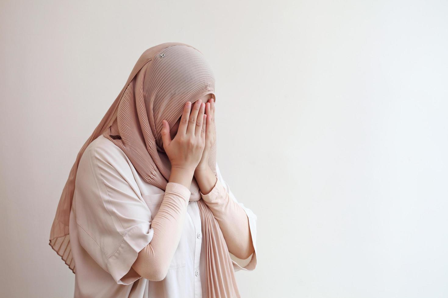 Muslim praying for god during work from home. photo