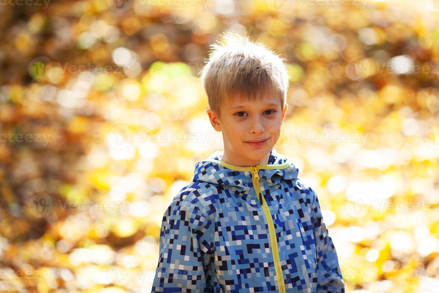 Portrait of a happy smiling blonde boy photo