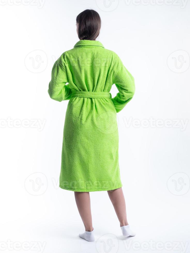 woman in a dressing gown from the back on an isolated white background. photo