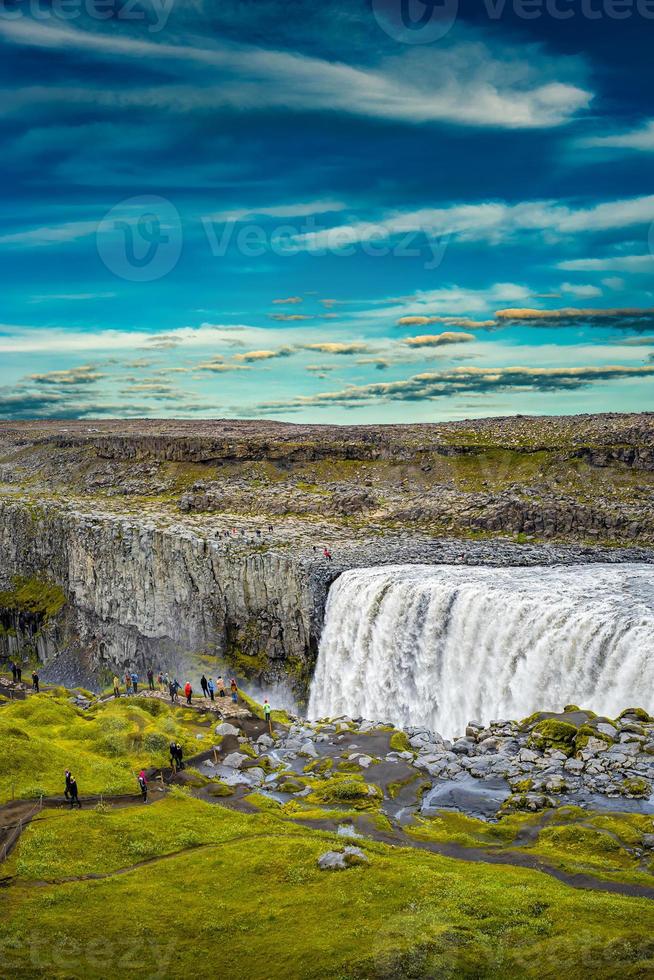 View over biggest and most powerful waterfall in Europe called Dettifoss in Iceland, near lake Myvatn, at blue sky, summer photo