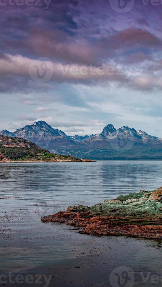 Beautiful sunset at Ensenada Zaratiegui Bay in Tierra del Fuego National Park, near Ushuaia and Beagle Channel, with geological mineral deposits, Patagonia, Argentina, early Autumn. photo