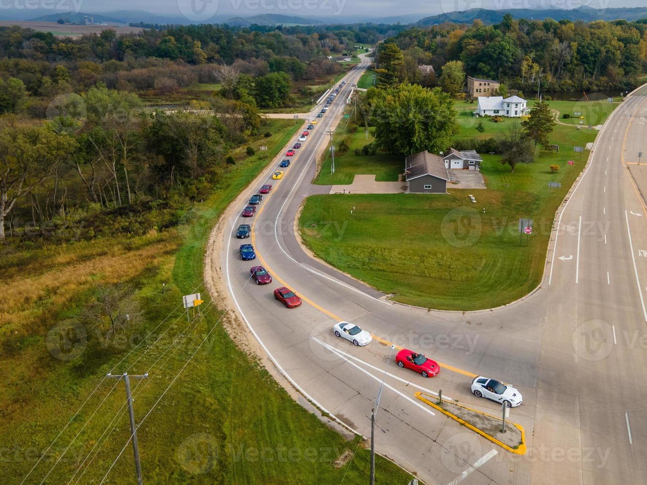 car tour through rural roads to highway in autumn, plenty of green grass and foliage, country home photo