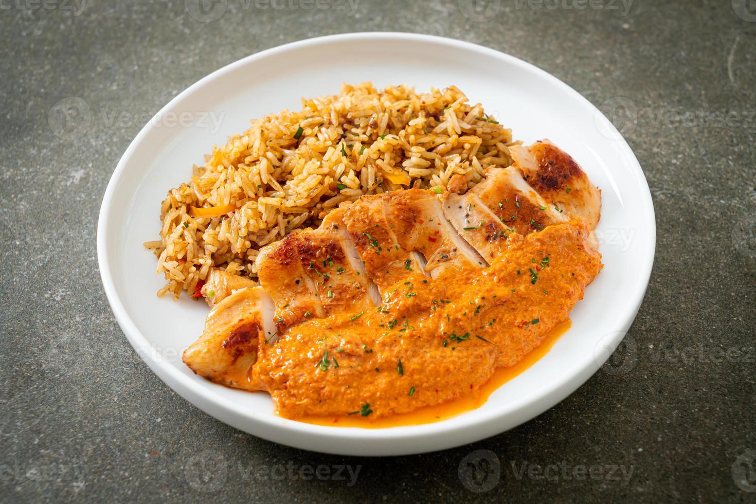 grilled chicken steak with red curry sauce and rice photo