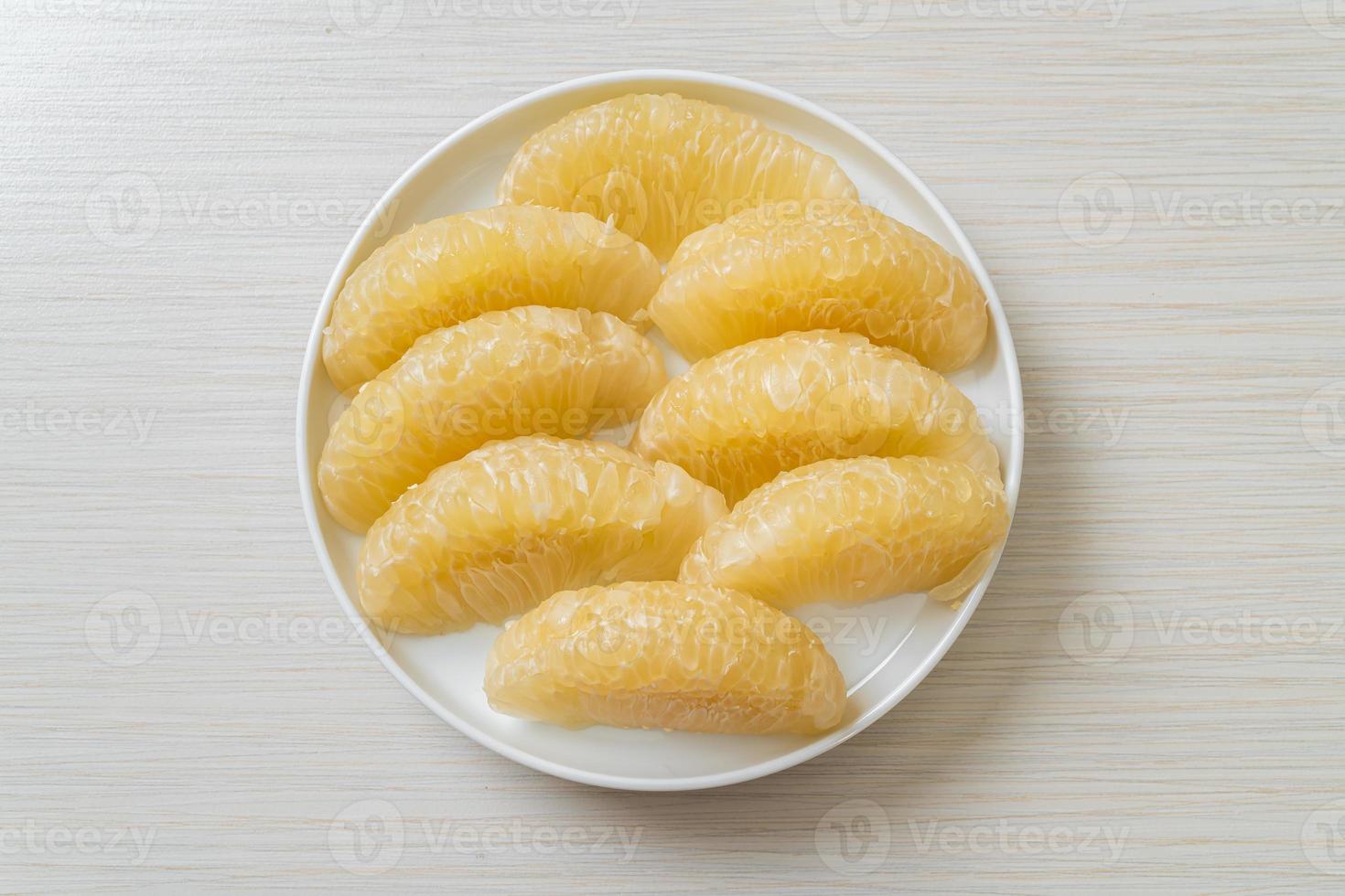 Fresh peeled pomelo, grapefruit or shaddock photo