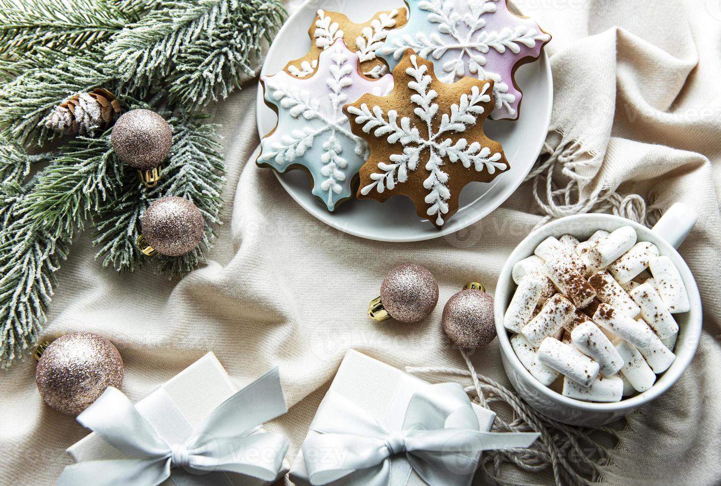 Christmas background with gift box, cocoa and gingerbread cookies. photo