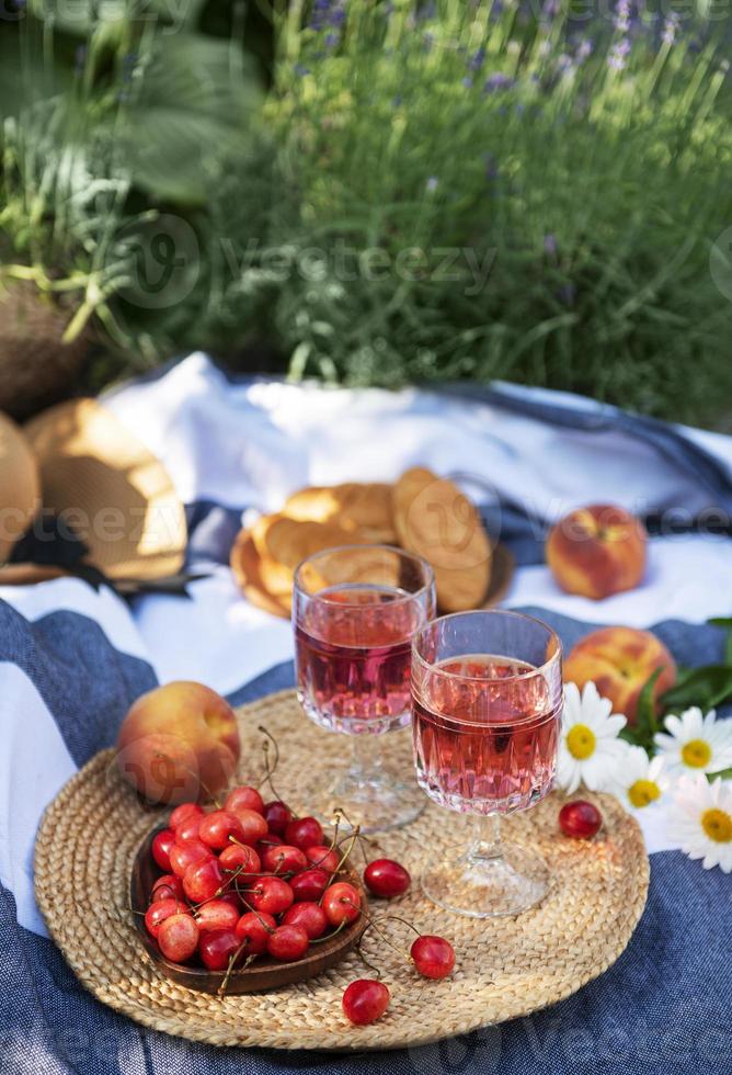 Set for picnic on blanket in lavender field photo