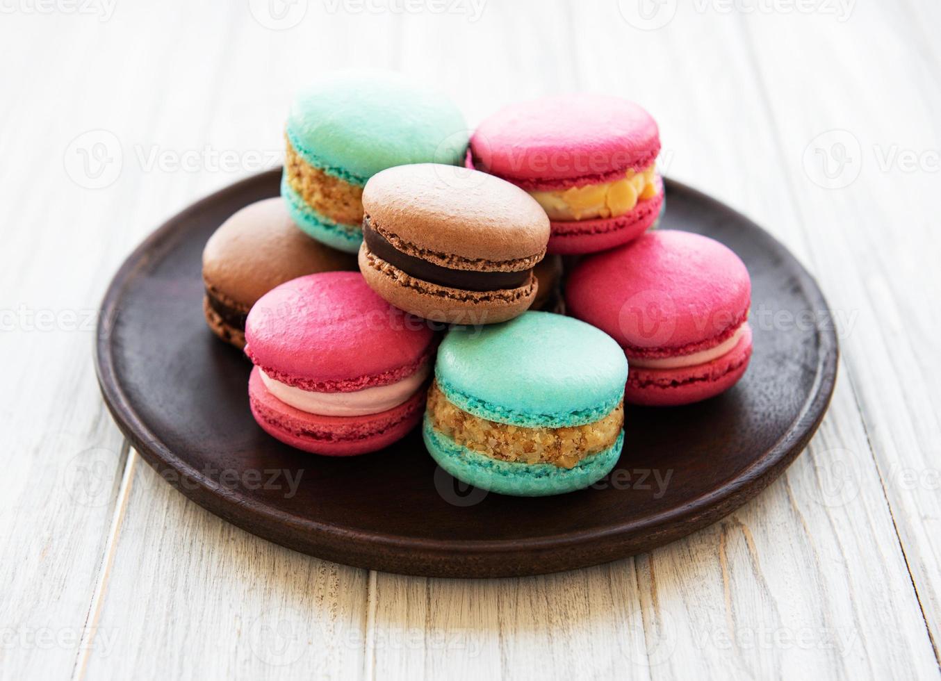 Colorful macaroons on a table photo