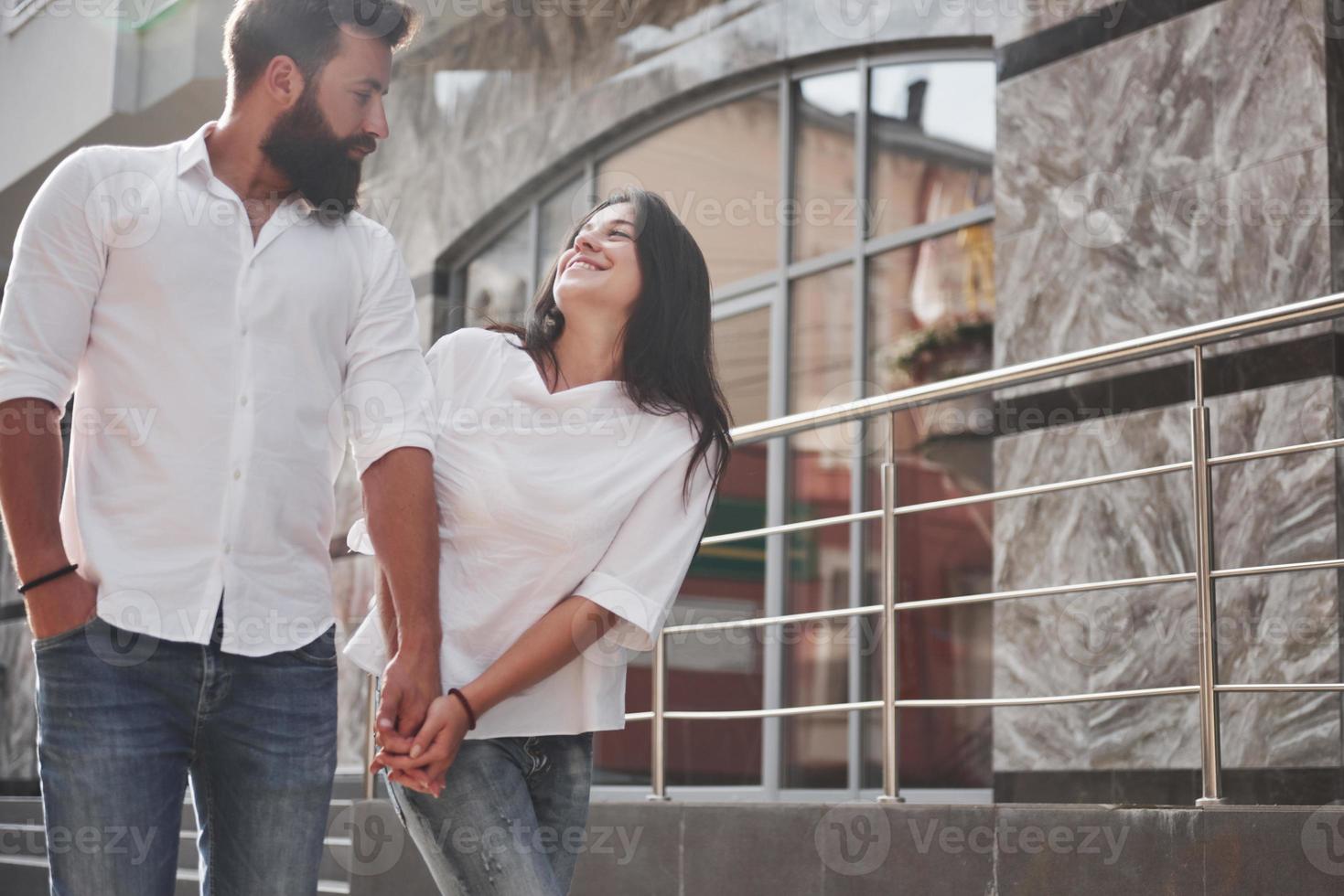 A young funny loving couple have fun on a sunny day. photo