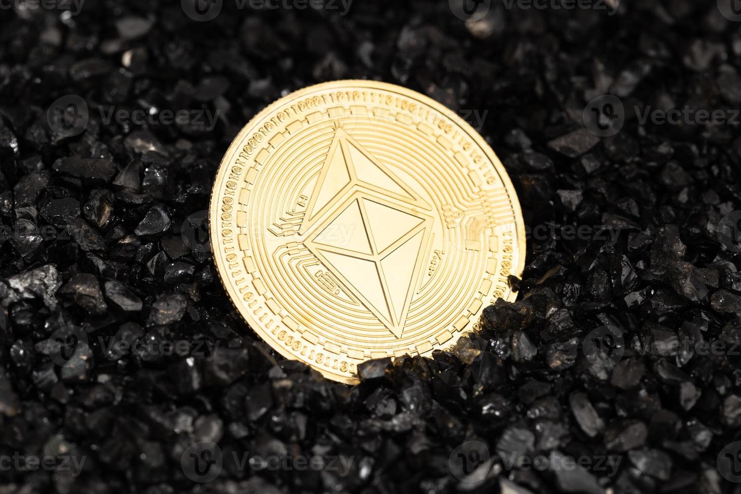 Ethereum classic coin on black gravel background. Cryptocurrency blockchain money photo