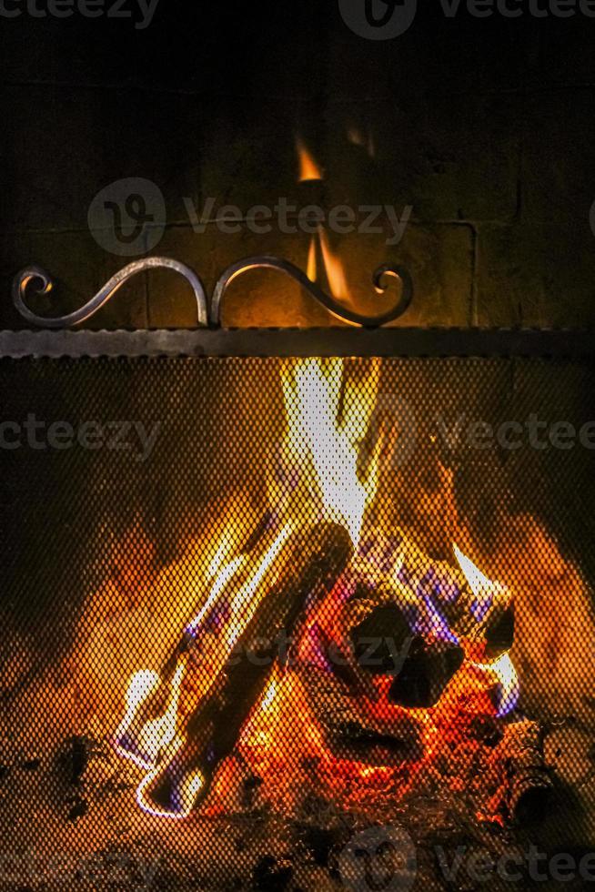 Romantic bright open fire on wood in hut in Norway. photo