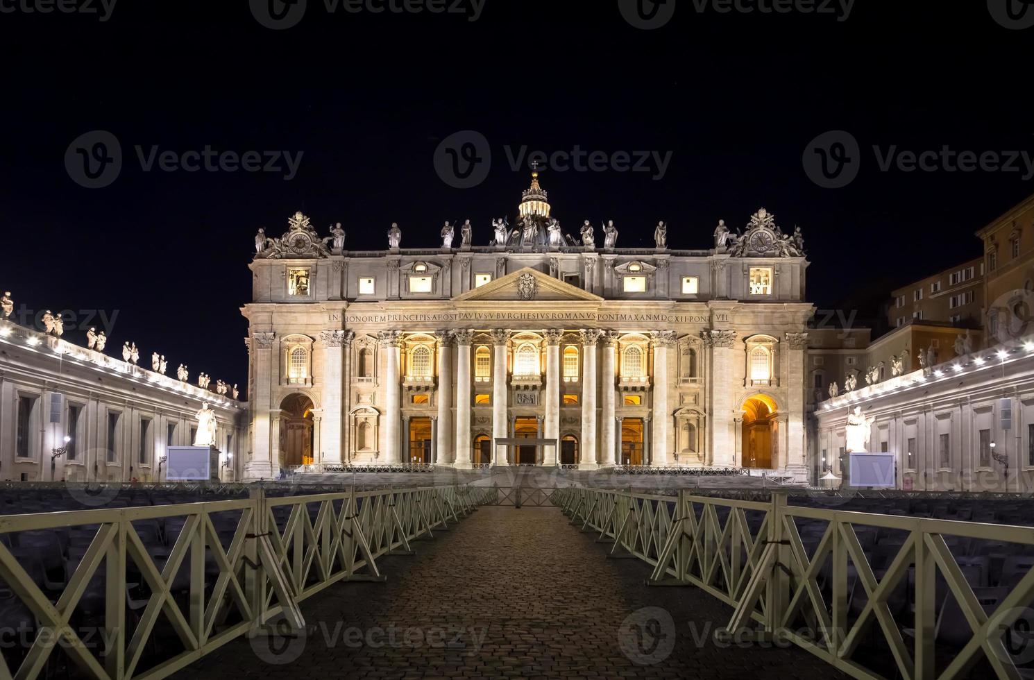 Saint Peter Basilica in Vatican City illuminated by night, masterpiece of Michelangelo and Bernini photo