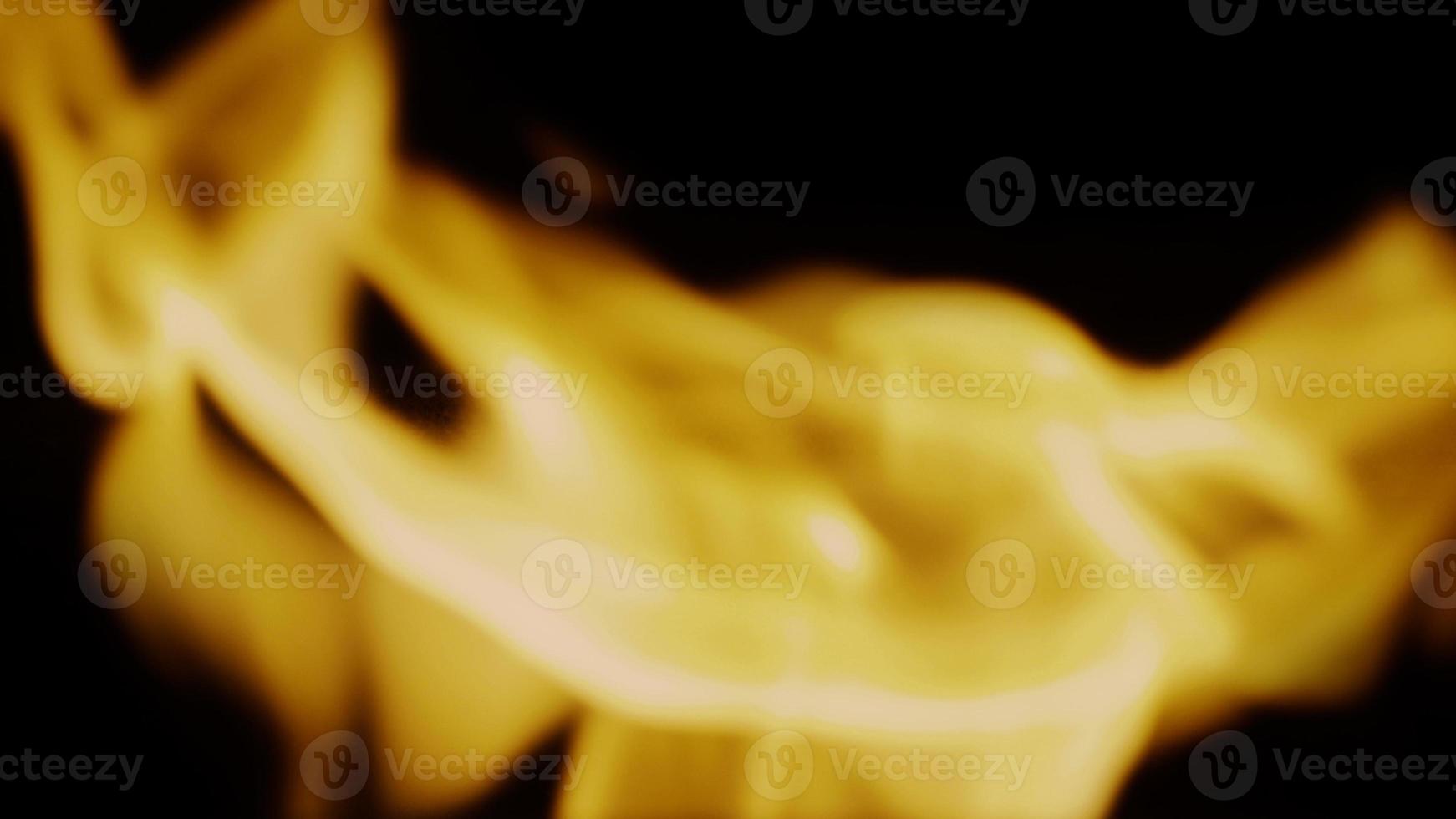 Fire background. Abstract burning flame and black background. photo