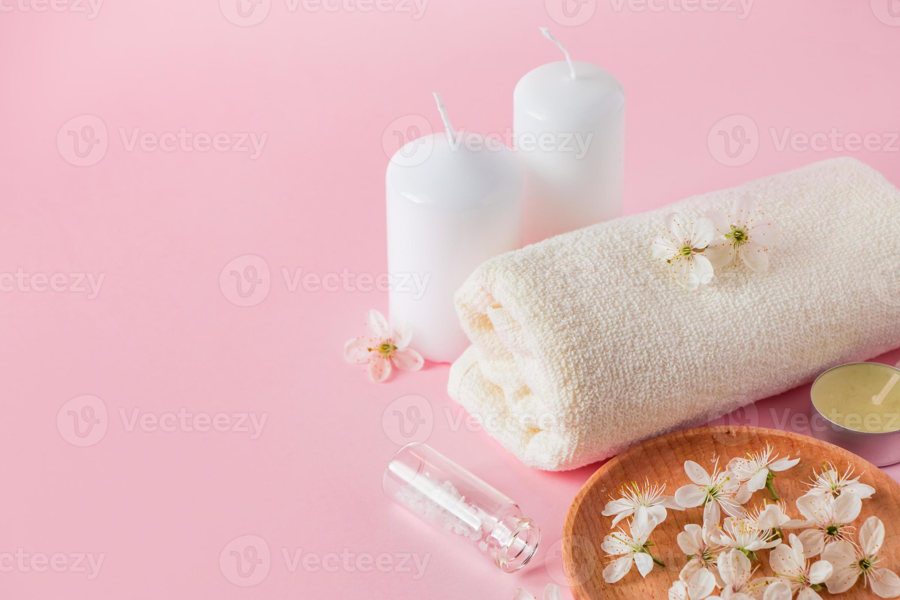 https://static.vecteezy.com/system/resources/previews/003/840/567/large_2x/natural-cosmetic-products-for-spa-and-aromatherapy-relaxation-concept-candles-flowers-and-a-towel-on-a-pink-background-photo.jpg