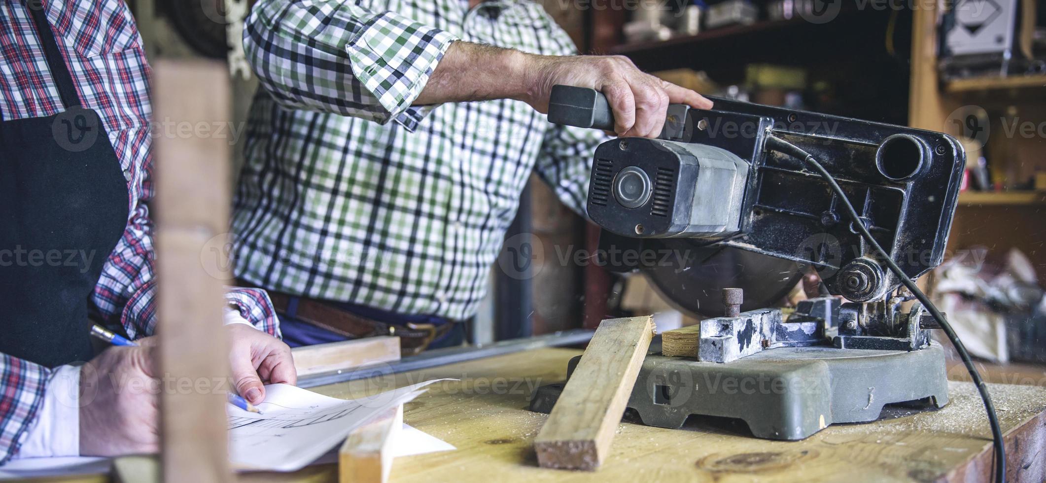 Unrecognizable senior couple in a carpentry photo